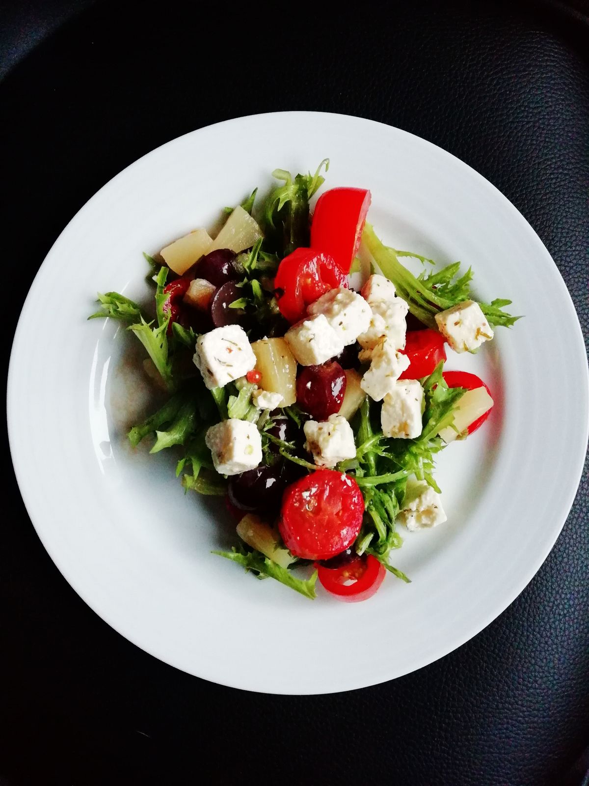 Illustrative food photograph: tomato, cucumber and feta plate for a quick lunch