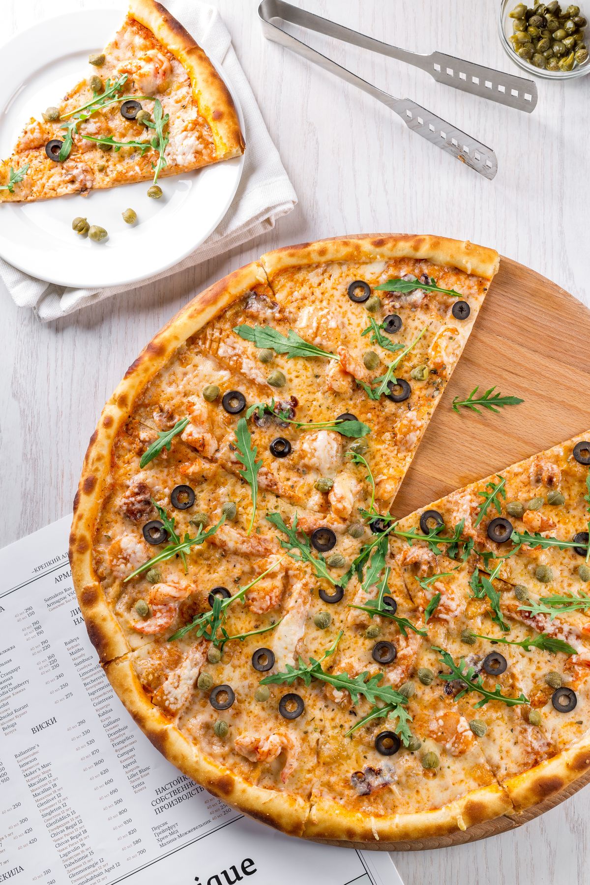 Illustrative food photograph: thin flatbread pizzas for a low-effort dinner