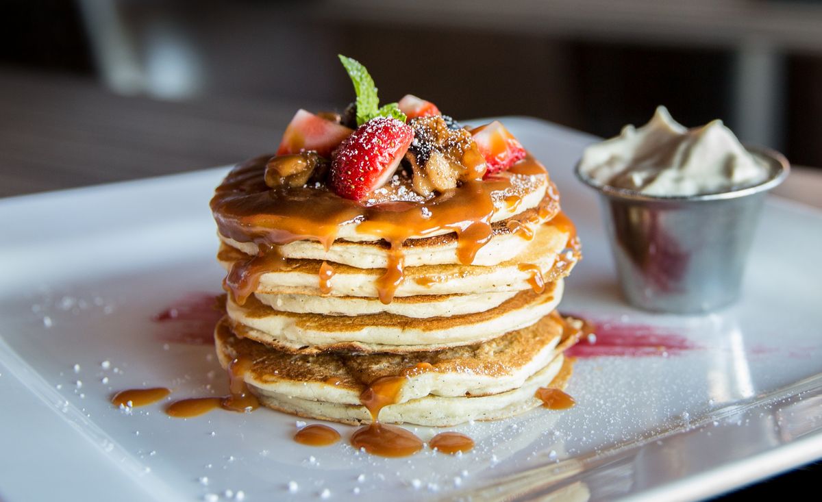 Illustrative food photograph: small-batch fluffy pancakes with berries