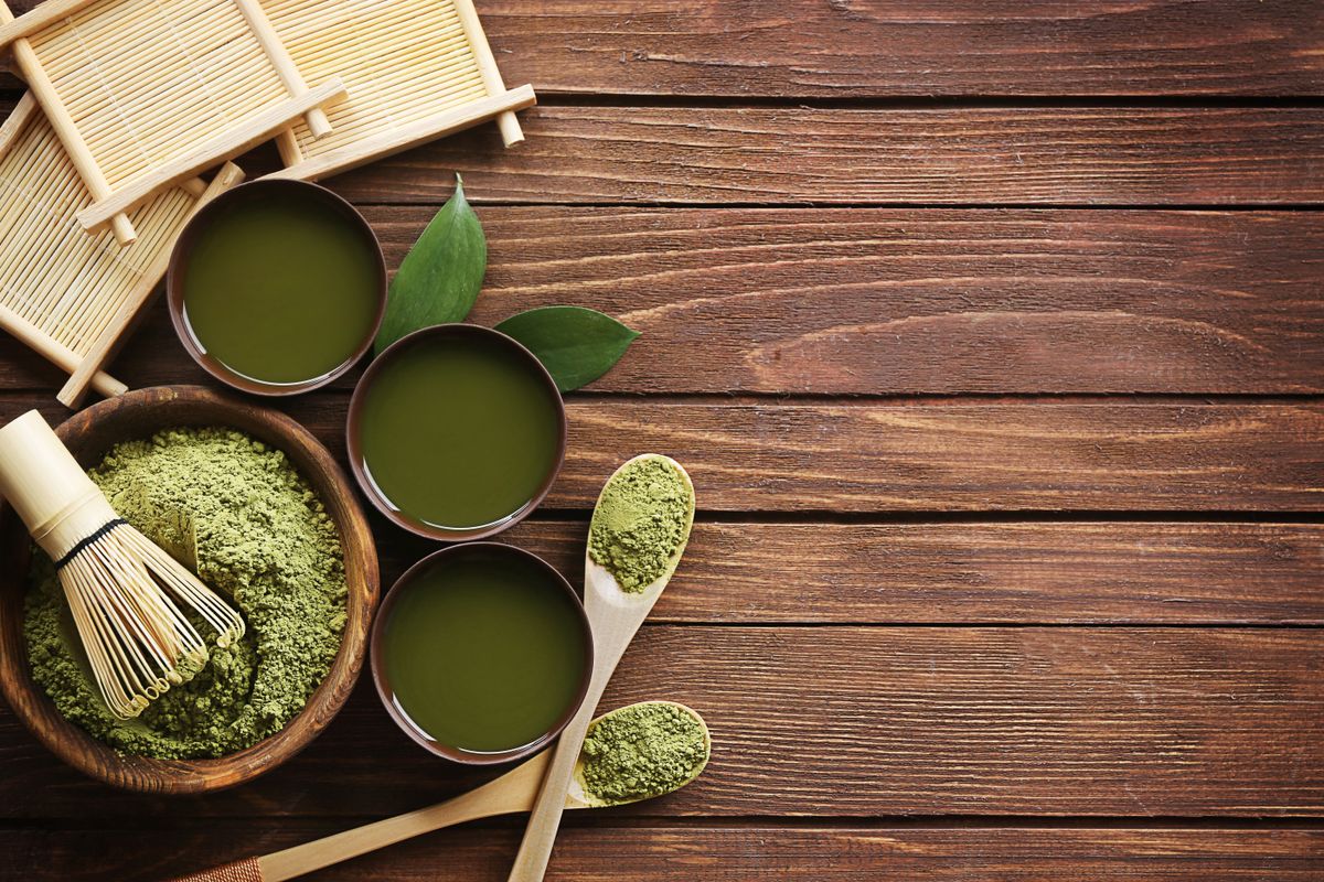 Illustrative food photograph: a small matcha latte with a smooth finish